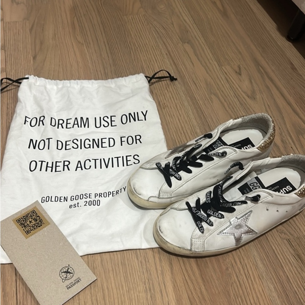 Golden goose superstar sneakers with glittery heel tab